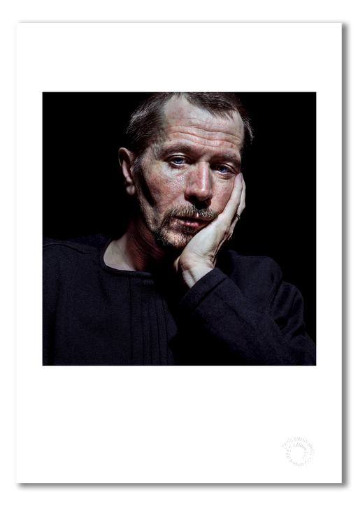 Colour portrait of Gary Oldman by Gavin Evans, 1998. Lost off-camera gaze, black background. A3 giclée print with white border, Icons Collection.