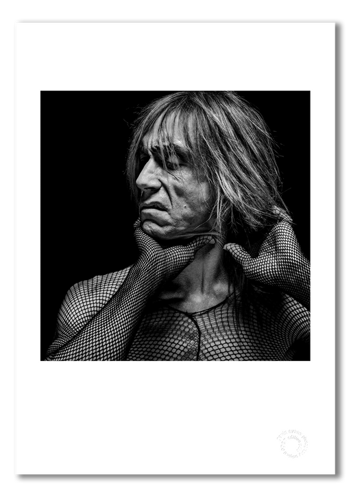Black and white studio portrait of Iggy Pop by Gavin Evans, 1996. Contorted pose, raw and disturbing. A3 giclée print with white border, Iggy Pop Collection.