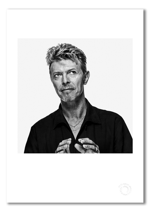 Black and white off-camera portrait of David Bowie by Gavin Evans, 1995. Graphic gaze, A3 giclée print with white border, Bowie Collection.