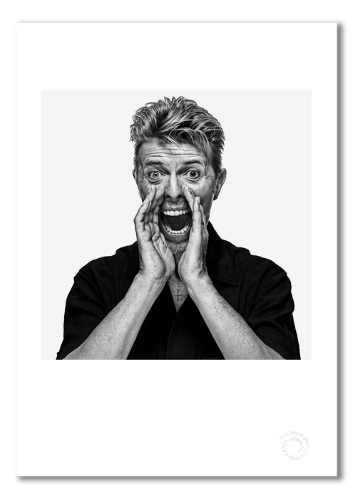 Black and white portrait of David Bowie by Gavin Evans, 1995. Hands cupped, shouting pose. A3 giclée print with white border, Bowie Collection.
