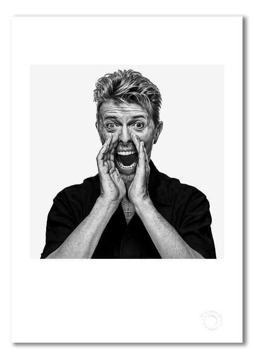 Black and white portrait of David Bowie by Gavin Evans, 1995. Hands cupped, shouting pose. A3 giclée print with white border, Bowie Collection.