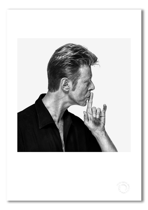 David Bowie profile portrait by Gavin Evans, 1995. Finger to lips in shushing pose. A3 giclée with white border, Bowie Collection.