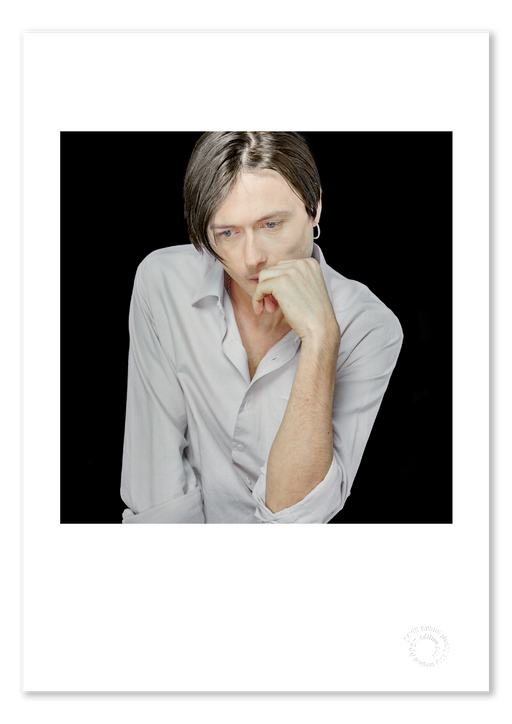 A3 giclée print of Brett Anderson by Gavin Evans, 1996. Colour studio portrait, contemplative, part of the Icons Collection. Shown as A3 giclée print with white border, embossed for authenticity.