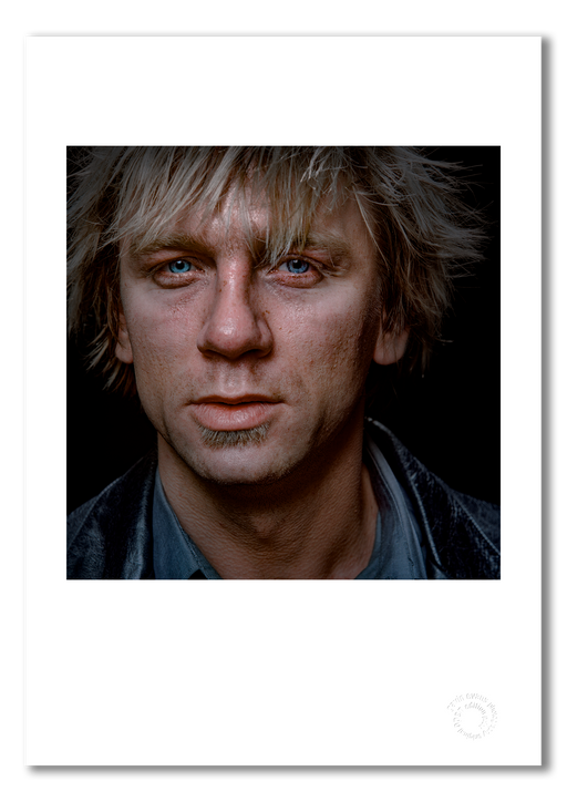 Colour close-up portrait of Daniel Craig by Gavin Evans, 1999. Brooding gaze, black background. A3 giclée print with white border, Icons Collection.