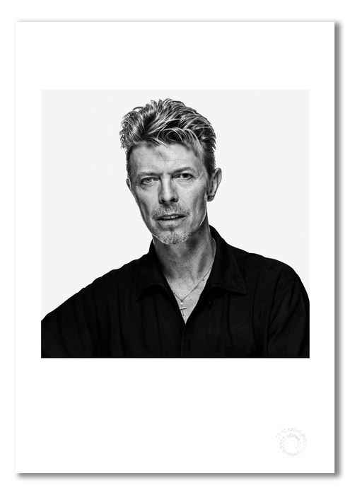 Black and white portrait of David Bowie by Gavin Evans, 1995. Direct eye contact, calm expression. A3 giclée print with white border, Bowie Collection.