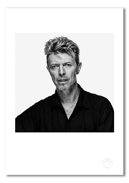 Black and white portrait of David Bowie by Gavin Evans, 1995. Direct eye contact, calm expression. A3 giclée print with white border, Bowie Collection.