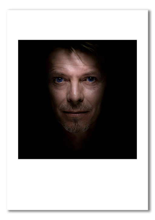 Colour portrait of David Bowie by Gavin Evans, 1995. Sapphire blue contact lenses, serene expression. A3 giclée print with white border, Bowie Collection.