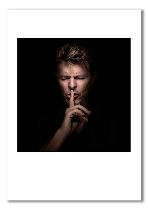 Colour portrait of David Bowie by Gavin Evans, 1995. Eyes closed in intense shushing pose. A3 giclée print with white border, Bowie Collection.