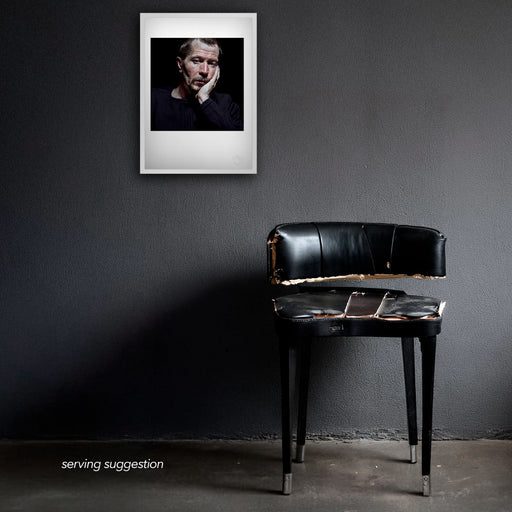 Framed colour portrait of Gary Oldman by Gavin Evans, 1998. Gazing off-camera with distant expression, displayed in dilapidated room, Icons Collection.