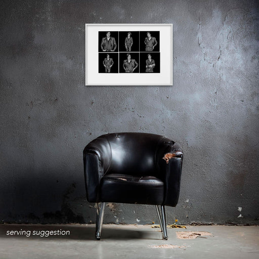 Framed A2 Lightbox of Brett Anderson by Gavin Evans. Six monochrome frames in leather jacket. Displayed in dilapidated monochrome room, Lightbox Collection.