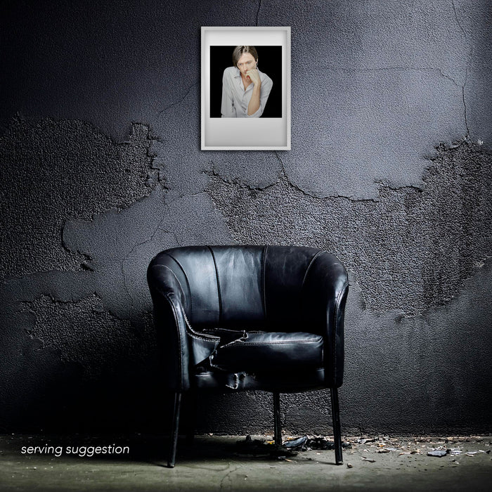 A3 giclée print of Brett Anderson by Gavin Evans, 1996. Colour studio portrait, contemplative, part of the Icons Collection. Displayed framed in a distressed room setting for visual context.