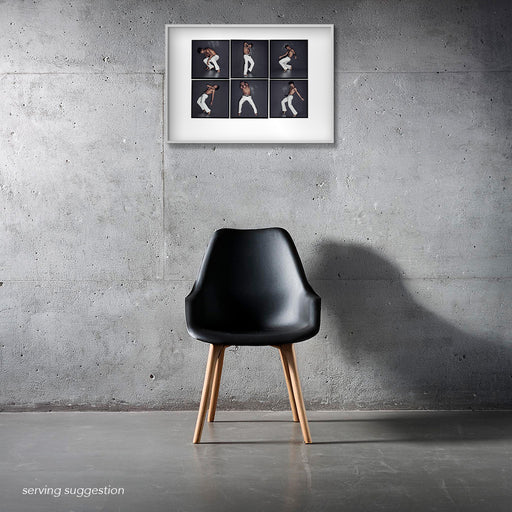 ramed A2 Lightbox portrait of Carlos Acosta by Gavin Evans. Six dancing frames displayed in a monochrome interior, The Lightbox Collection.