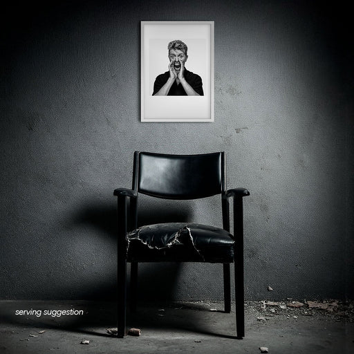 Framed B&W print of David Bowie shouting with hands cupped, photographed by Gavin Evans. Displayed in disused interior, Bowie Collection.