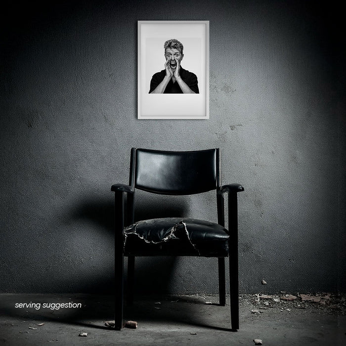 Framed B&W print of David Bowie shouting with hands cupped, photographed by Gavin Evans. Displayed in disused interior, Bowie Collection.