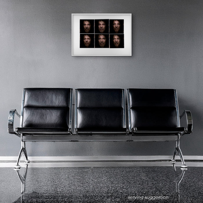 Framed colour Lightbox of David Bowie by Gavin Evans. Six close-up images looking out from shadow. Displayed in an airport waiting lounge, Lightbox Collection.