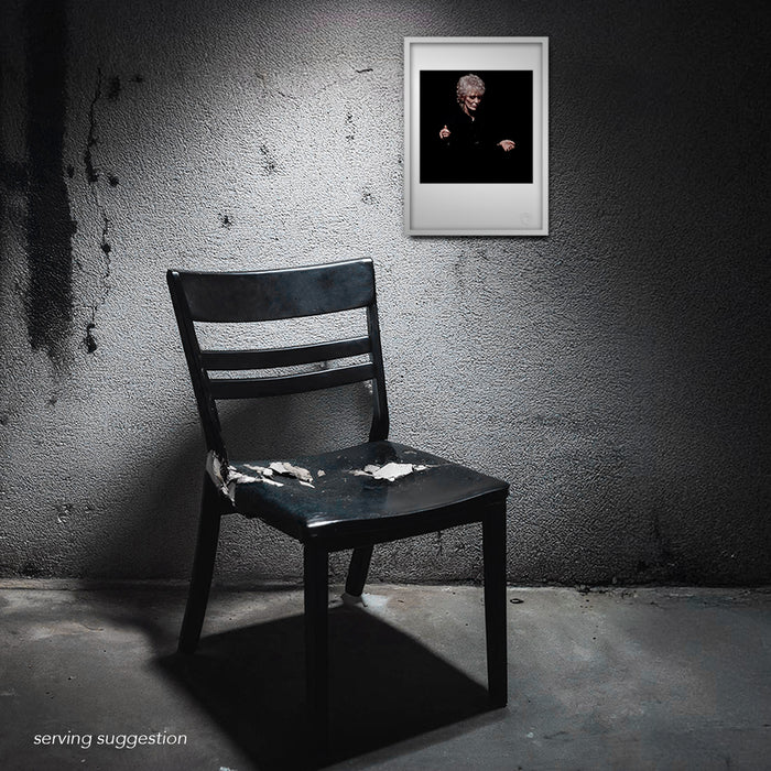 The Dusty Springfield A3 colour portrait framed and hung in a dystopian interior. This visual juxtaposition is a stark contrast to her grace and beauty. Photographed by Gavin Evans.