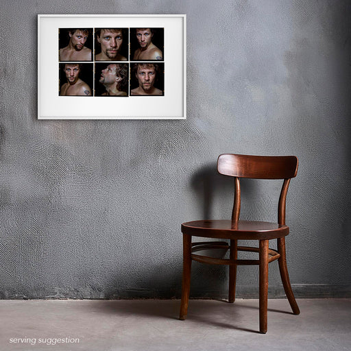 Framed A2 Lightbox of Jon Bon Jovi by Gavin Evans. Colour portraits from 1996, black background. Displayed in a monochrome room, Lightbox Collection.