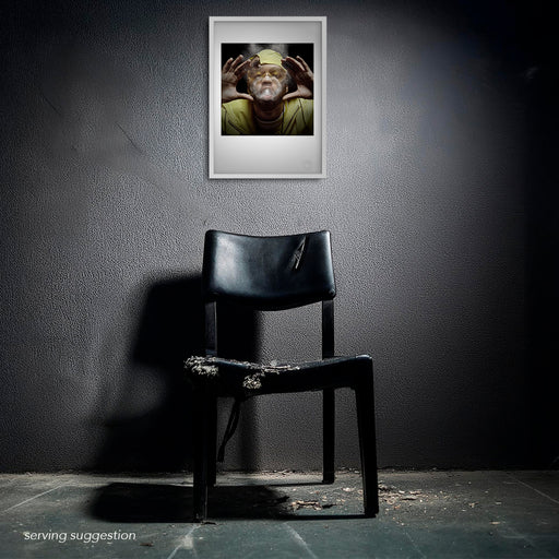 Framed Method Man portrait by Gavin Evans, 1997. Smoke ring and yellow wrap-around shades create striking contrast in raw setting, Icons Collection.