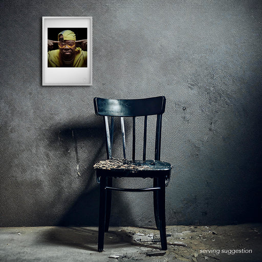 Framed Method Man portrait by Gavin Evans, 1997. Wearing yellow jacket and sunglasses, posed against black in raw interior, Icons Collection.