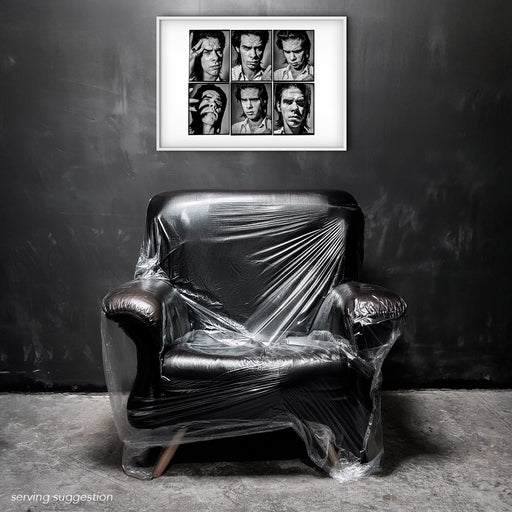 Framed A2 Lightbox of Nick Cave by Gavin Evans. Six monochrome headshots displayed in a monochrome room, Lightbox Collection.