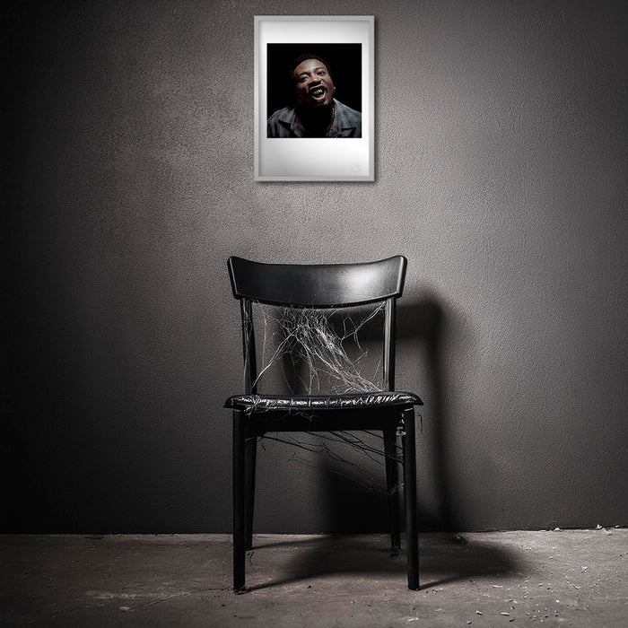 Framed A3 fine art print of Ol’ Dirty Bastard in a distressed room. The colour image’s chaotic power contrasts sharply with the worn interior, amplifying its raw, unpredictable energy.