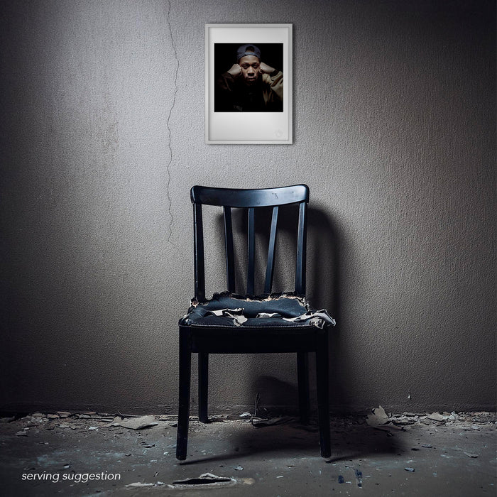 Framed version of the RZA A3 print shown in a distressed, textured room. The portrait’s close-up composition and deep black background create a powerful focal point that radiates intensity in any setting.