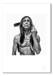 Iggy Pop #1, bare-chested, crow feathers, one finger raised, black and white, London 1996, by Gavin Evans — fine art photography print