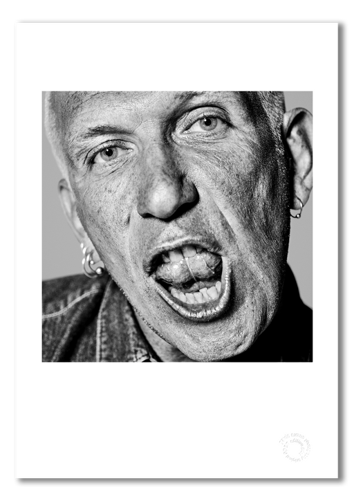 A3 open edition fine art print of Jean Paul Gaultier with a white border, printed on semi-matt archival cotton paper. This close-up black and white portrait from 1996 captures the designer’s confident energy. Embossed for authenticity.