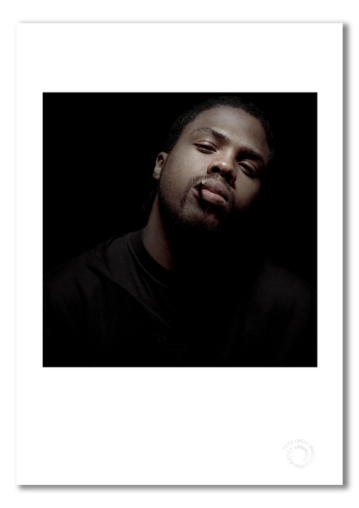A3 open edition fine art print of Masta Killa with a white border, printed on semi-matt archival cotton paper. This colour studio portrait from 1997 captures the Wu-Tang Clan artist in a moment of composed intensity. Embossed for authenticity.