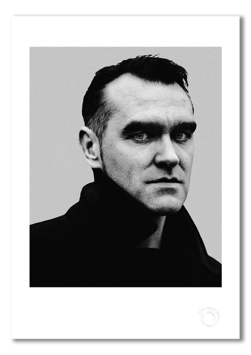 Intense B&W studio portrait of Morrissey by Gavin Evans, 1997. Direct gaze, graphic lighting, Icons Collection. Shown as A3 giclée print with white border, embossed for authenticity.