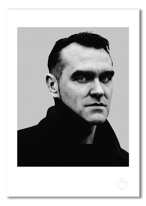 Intense B&W studio portrait of Morrissey by Gavin Evans, 1997. Direct gaze, graphic lighting, Icons Collection. Shown as A3 giclée print with white border, embossed for authenticity.