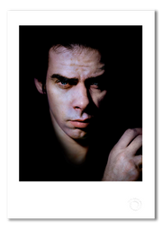 Nick Cave #6, direct gaze, close-up, colour, black background, Bayswater London 1989, by Gavin Evans — fine art photography print