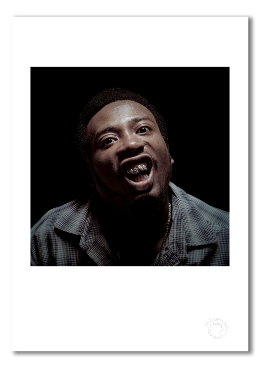 A3 open edition giclée print of ODB, presented with a white border on semi-matt archival cotton paper. This intense, in-your-face colour studio portrait from 1997 is full of attitude and energy. Embossed with Gavin Evans’ authentication stamp.
