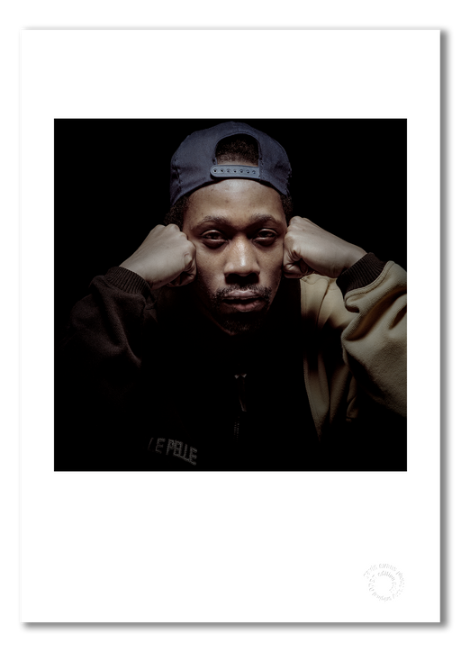 A3 open edition giclée print of RZA presented with a white border, printed on semi-matt archival cotton paper. Photographed in 1997 by Gavin Evans, this close-up studio portrait captures RZA’s intensity and iconic presence. Embossed for authenticity