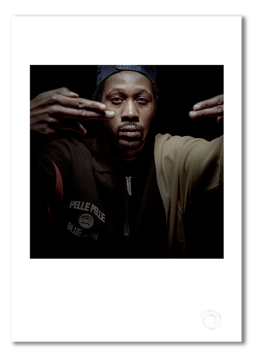 A3 open edition fine art print of RZA #2 featuring a white border, printed on archival cotton paper. Photographed in 1997 by Gavin Evans, this image offers a commanding view of the iconic hip-hop artist. Embossed for authenticity.