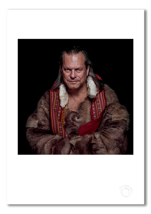 A3 open edition fine art print of Terry Gilliam wearing only a reindeer fur coat, with a white border and printed on semi-matt archival cotton paper. Photographed by Gavin Evans in 1996, this colour portrait captures the director’s signature theatricality. Embossed for authenticity.