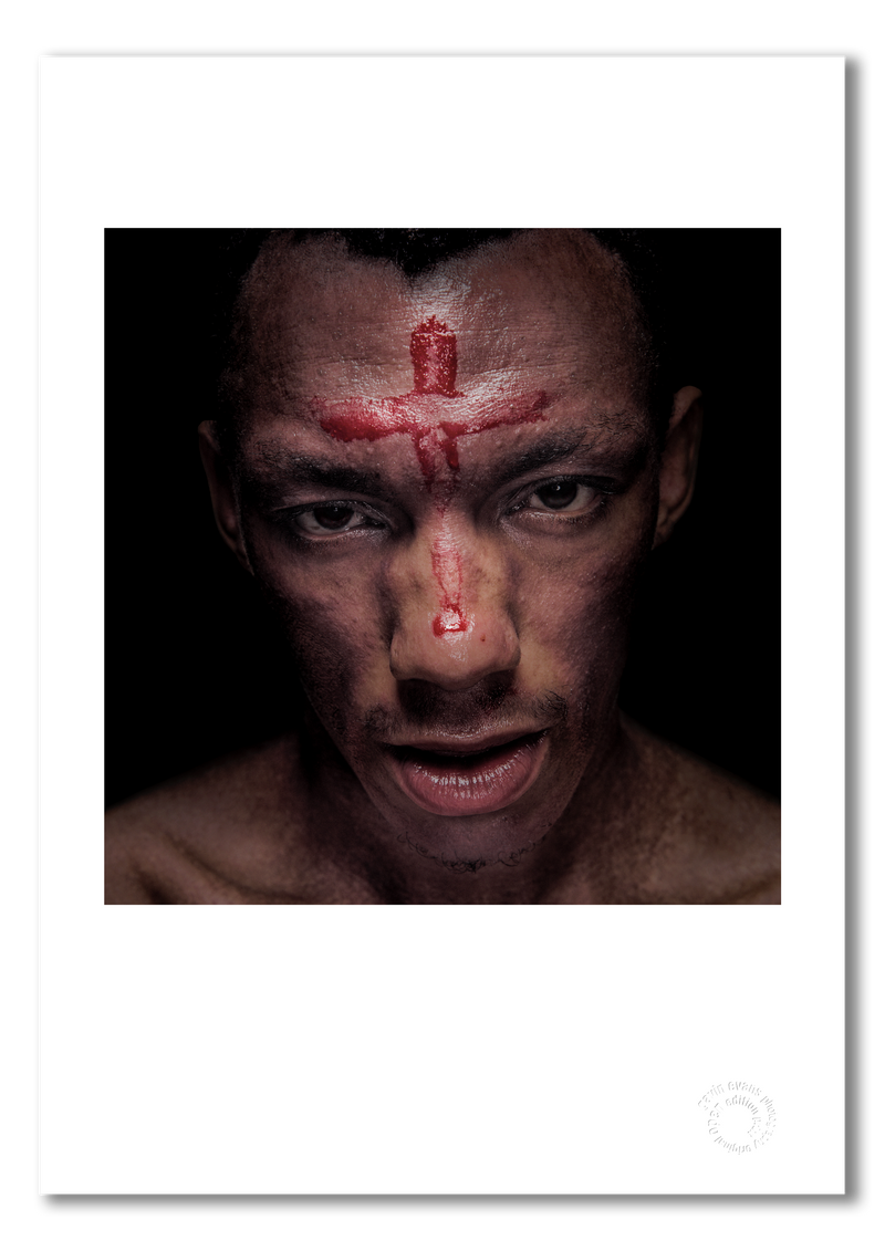 Tricky, cross of blood on forehead, colour shot, black background, London 1996, by Gavin Evans — fine art photography print
